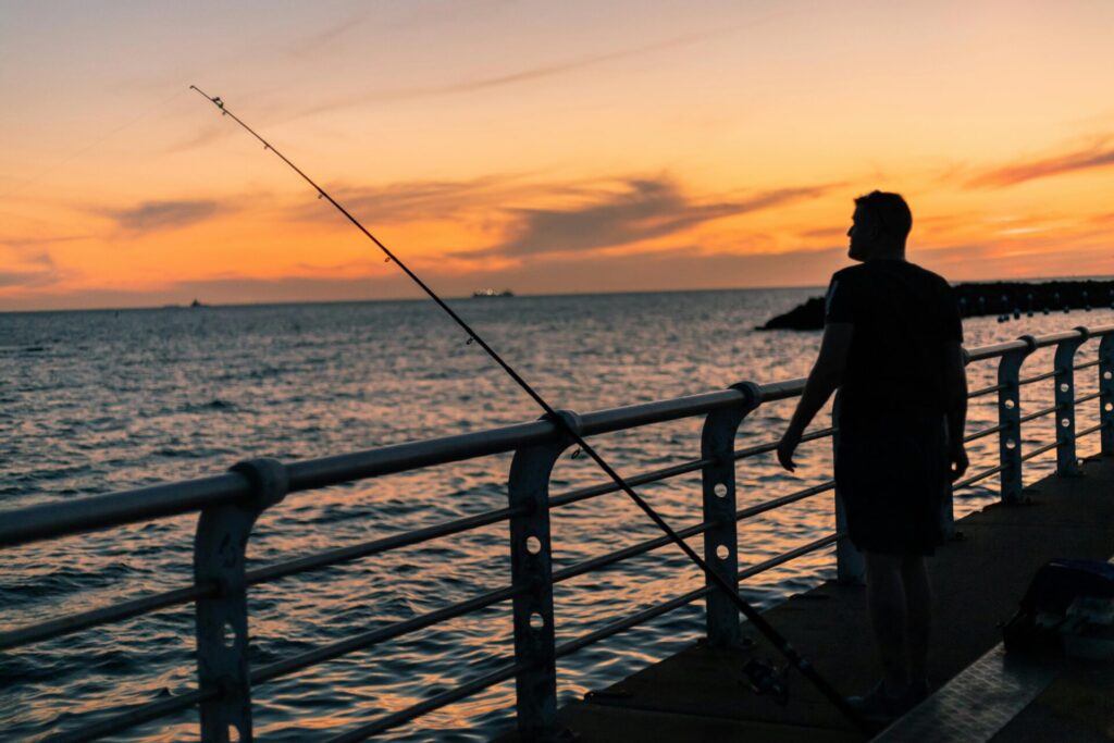 Fishing from a pier in Gulf Shores Alabama on the Gulf Coast
