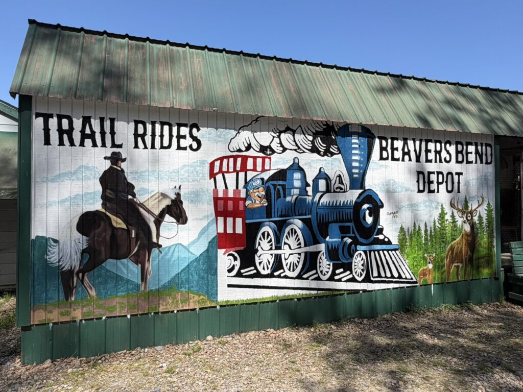 Beavers Bend Depot & Trail Rides attraction in Broken Bow, Oklahoma, offering train rides, horseback riding, and family activities.