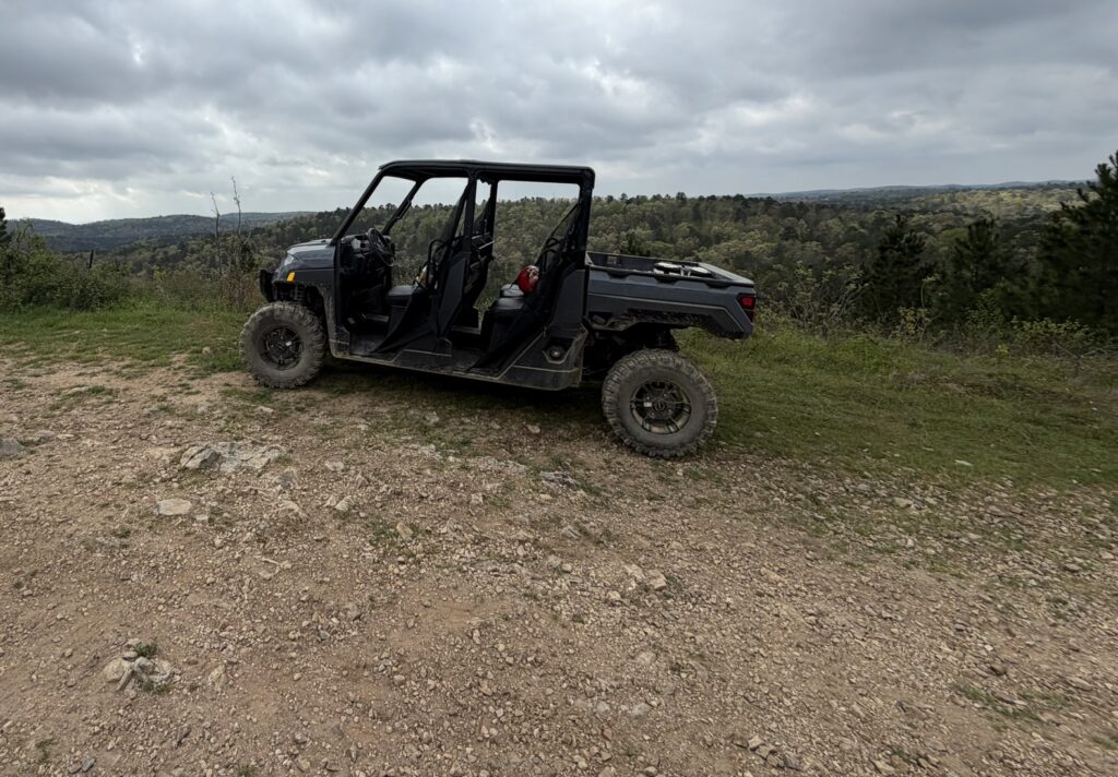 Side-by-side UTV overlooking the Ouachita Mountains during an off-road adventure near Broken Bow, Oklahoma.