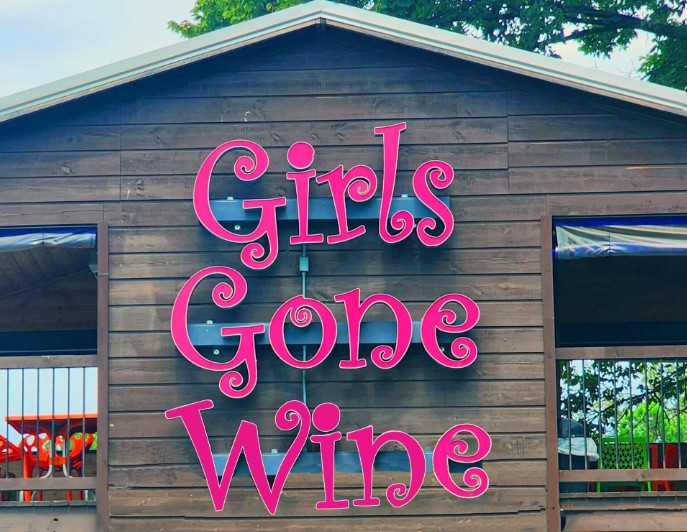 Entrance sign at Girls Gone Wine in Broken Bow, Oklahoma.