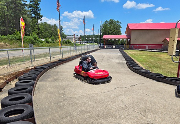 Family racing go-karts at BigFoot Speedway in Broken Bow, Oklahoma.
