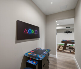 Arcade game in the game room at Bear Ridge Escape