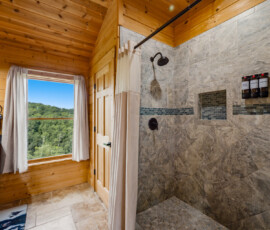 Full bathroom with tiled shower at Bear Ridge Escape