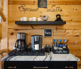 Dedicated coffee bar with coffee makers and supplies at Bear Ridge Escape