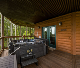 Covered deck seating with panoramic Smoky Mountain views