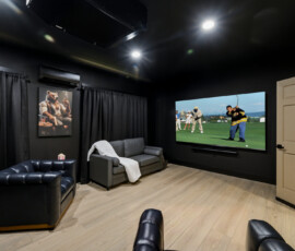 Private theater room with large screen and reclining seats at Bear Ridge Escape